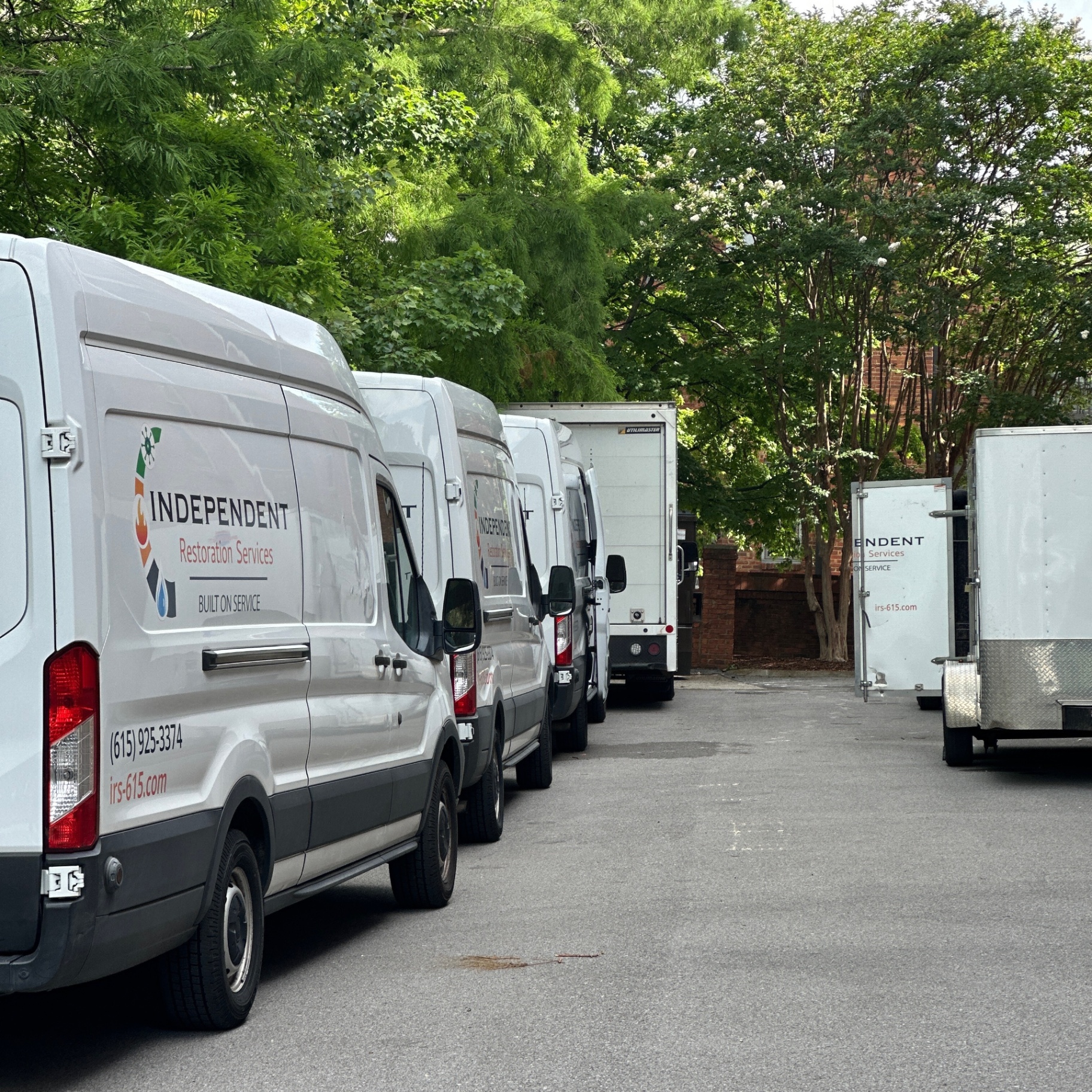 Independent Restoration Services fleet of service vans ready for dispatch