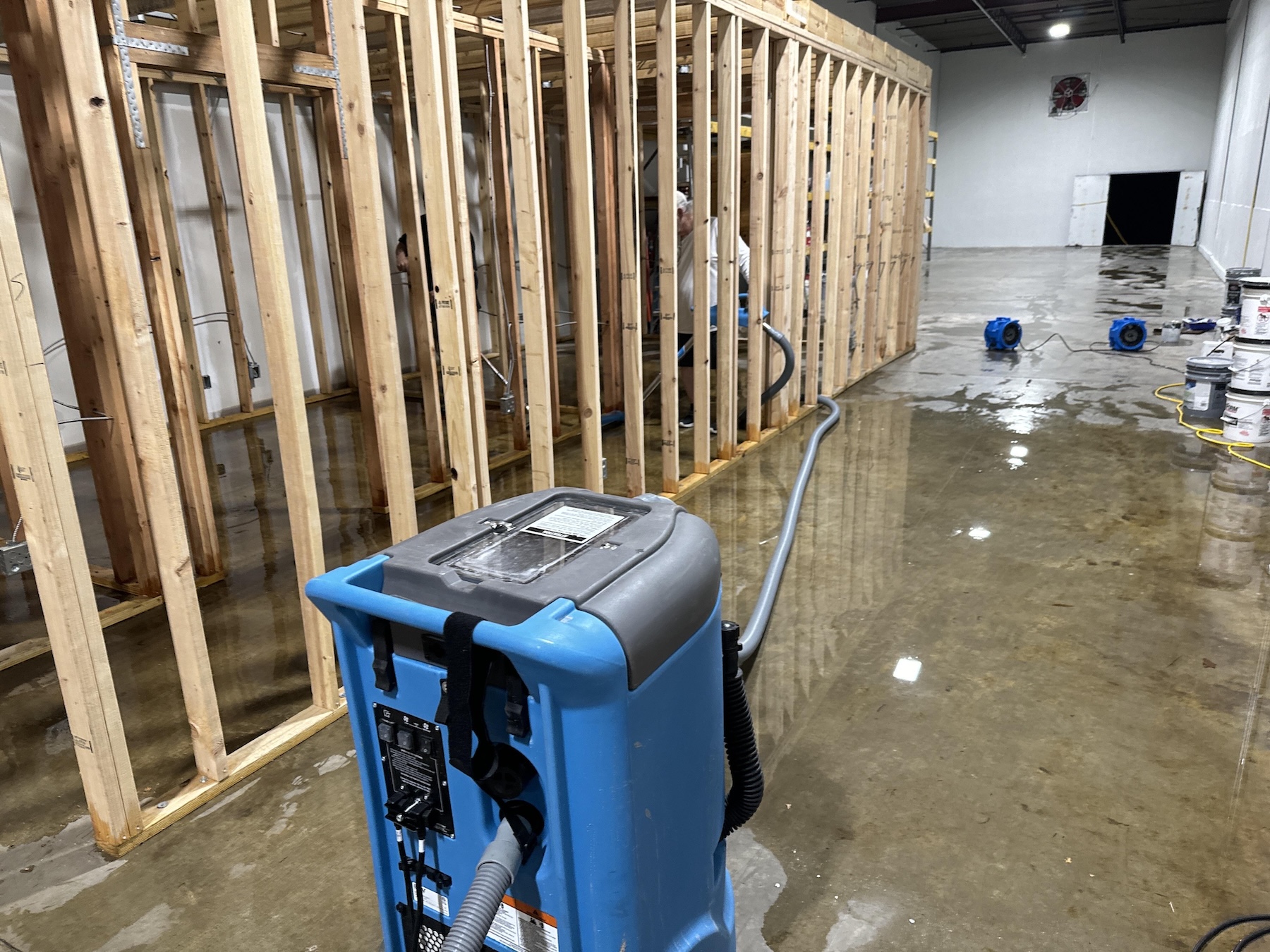 Commercial framing exposed and saturated after storm intrusion in Knoxville