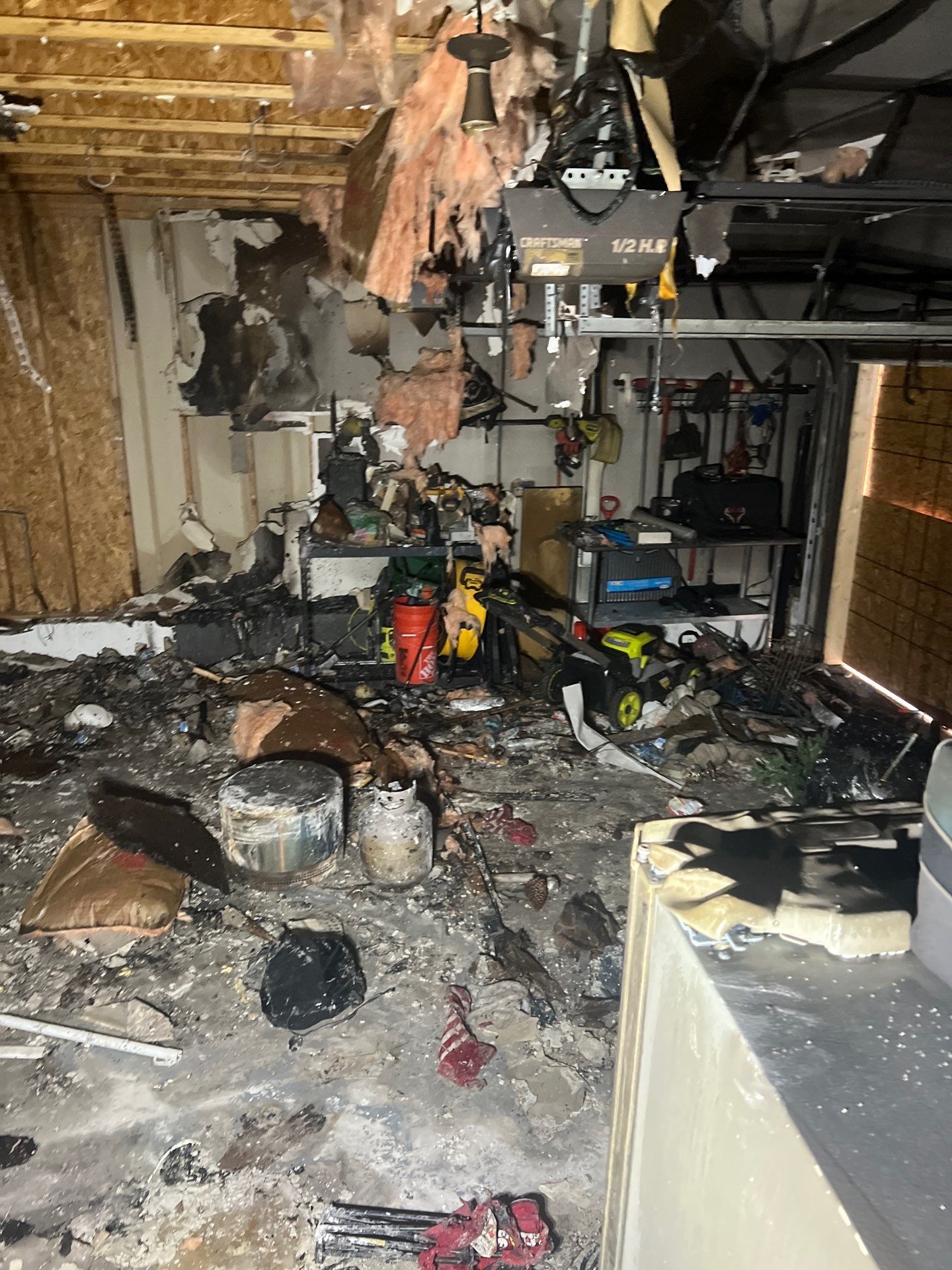 Extensive fire damage inside a Knoxville garage cleared by IRS crew