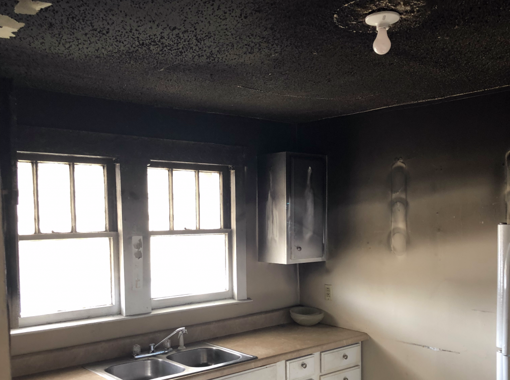 Heavy smoke and soot damage in a Knoxville kitchen after a fire